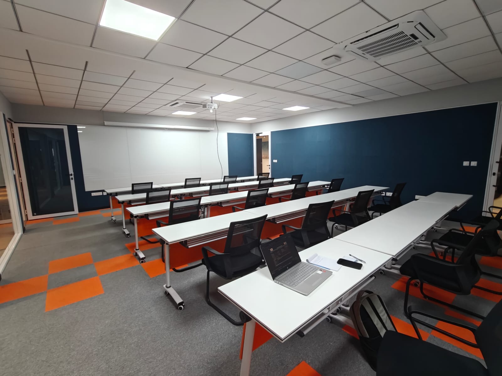 Contemporary coworking space in Hyderabad with stylish furniture and natural lighting